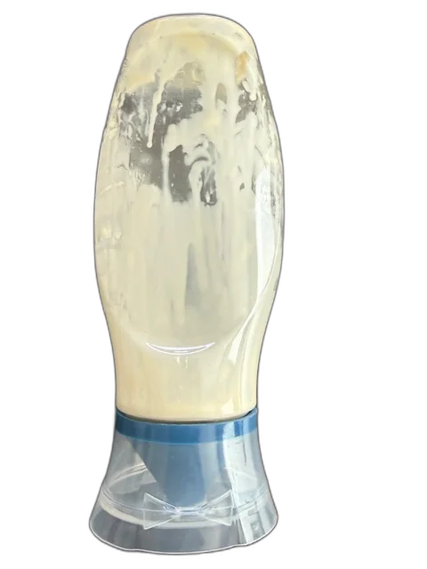 Mayo bottle turned upside down with visible product residue coating the inside walls