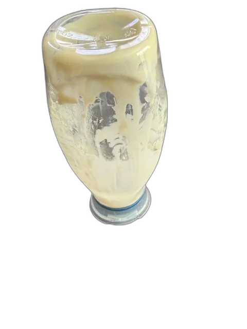 Close-up of an 'empty' mayo bottle showing significant product stuck to the sides